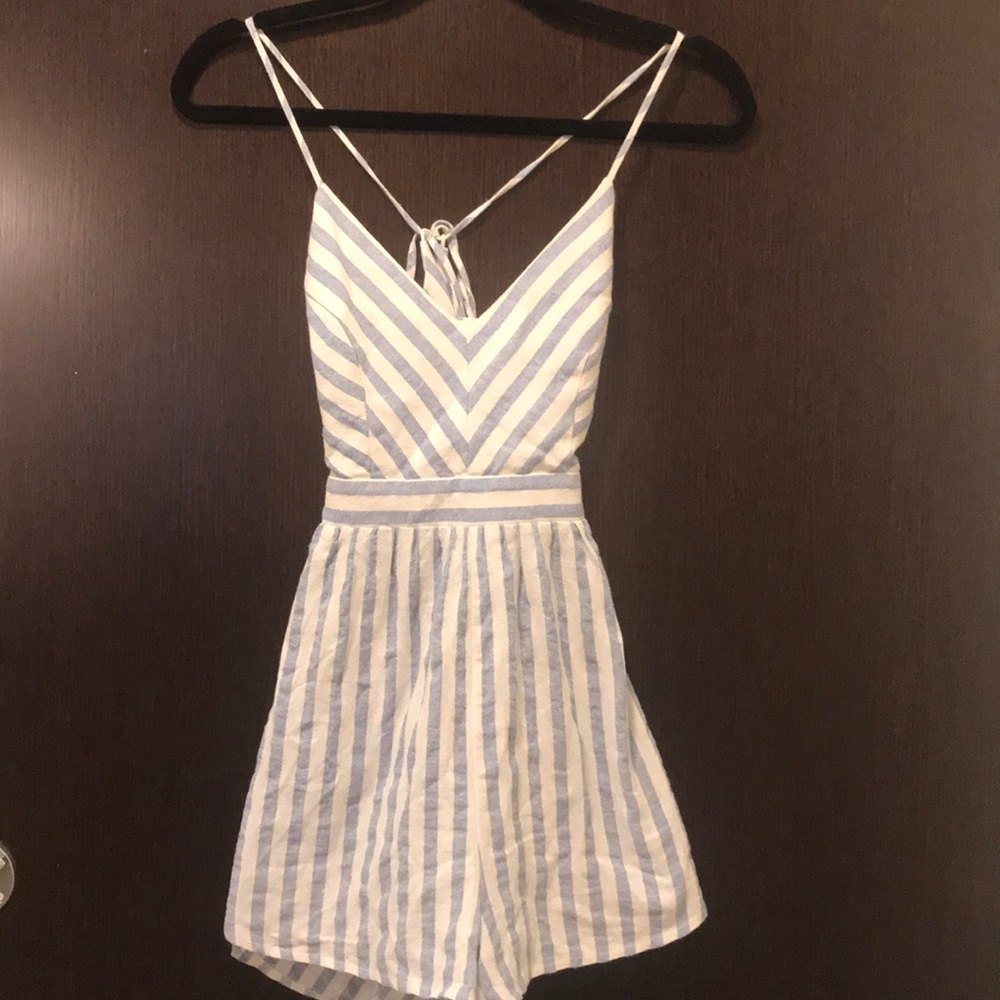 White and blue striped romper with cross back